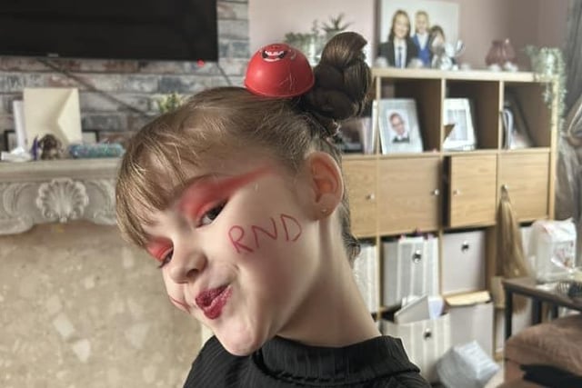 Red Nose Day-inspired make-up and hair.