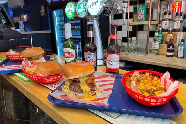 Foodies can enjoy burgers and dirty fries served with a cold beer.