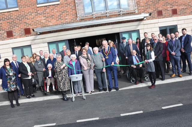 Bassetlaw councillor Deborah Merryweather with Priory Court resident James Forrester and Councillor Kevin Rostance of Nottinghamshire County
Council - with residents and guests at the opening of Priory Court