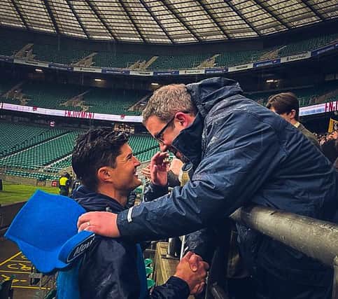 Headteacher Dan Wright shakes hands with head coach Dylan Campbell after victory at Twickenham.