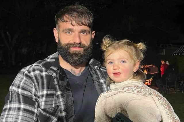 29-year-old Micah Bishop pictured with his daughter Bonnie on Bonfire Night earlier this month. Credit: Jack Jefferey