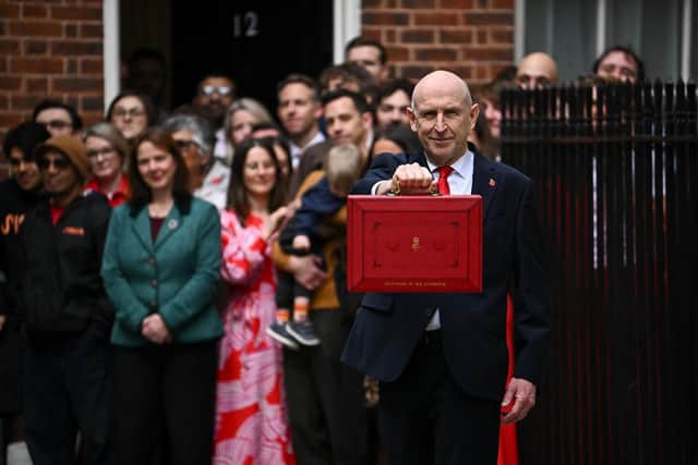 Chancellor of the Exchequer John Healey holds up the traditional red ministerial box as he leaves 11 Downing Street, London, before delivering his first Budget to the Houses of Parliament. Picture date: Wednesday October 28, 2026. PA Photo. Photo credit should read: Dylan Martinez/Press Association