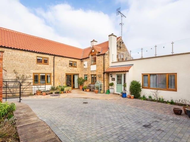 It's time to step outside now, which gives us the chance to drool over the courtyard garden, made of Indian stone, with planted borders. It is the ideal spot for alfresco dining and entertaining in the summer.