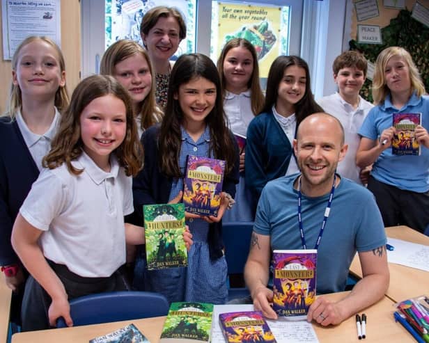 Leanne Moden, Newark Book Festival project manager, with author Dan Walker and children of St Mary's CE Primary School in Edwinstowe. (Photo by: Lou Brimble)