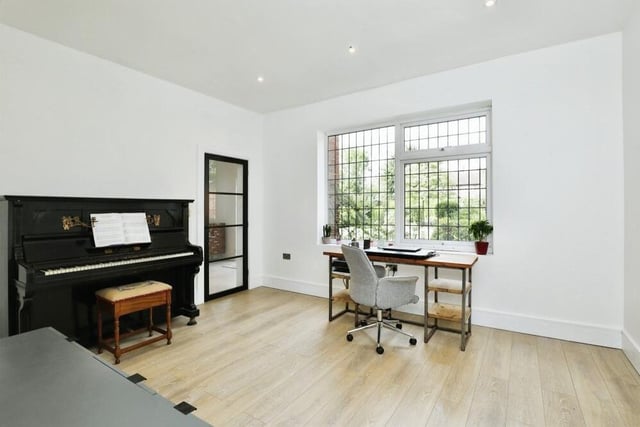 Another reception room on the ground floor of the £900,000 property is currently being used as a study, but is a versatile space. Natural light floods through a front-facing window.