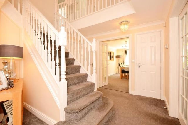 As we step from the dining room (background) and prepare to go upstairs, let's take a quick look at the entrance hallway and the handsome staircase.