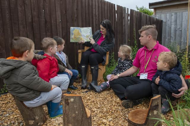 Lime Tree Nursery have created a new forest garden for the children, pictured with some of the children are Forest School leader Lizzi Hall and After School Room Lead Charlie Wright