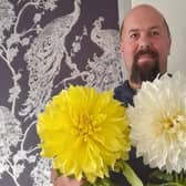 Steven Turner has grown huge dahlias, with the yellow one measuring 12-inches across, and the white one measuring 13.
