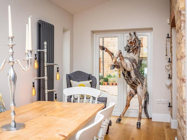Don't worry about the equine 'bouncer'! At one end of the family room are French doors leading out to the courtyard garden.
