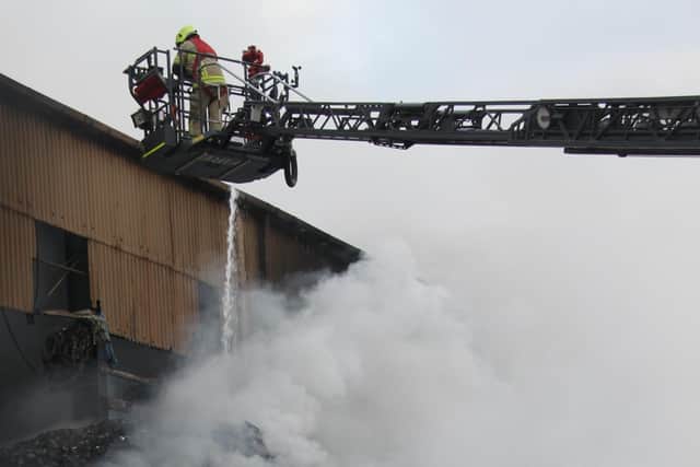 Firefighters tackling a blaze at Kiveton Park Industrial Estate in Rotherham on September 21. South Yorkshire Fire and Rescue said it was still at the scene this week and nearby residents have complained about the 'intolerable' fumes. Photo: South Yorkshire Fire and Rescue