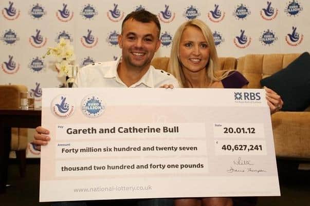 Mansfield Woodhouse winner Gareth Bull and his former wife Catherine with their cheque.