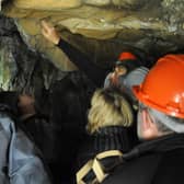 Visitors exploring the caves