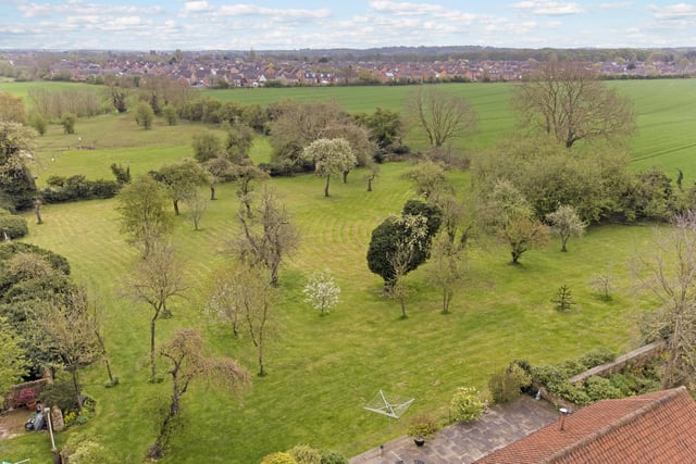 This aerial shot captures how extensive the grounds are at Manor Lodge. The plot stretches to 10.11 acres, so you can imagine the remarkable views from the bedrooms on the higher floors.