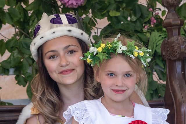 The newly-crowned Wellow May queen, Charlotte Baugh (left), with her crown bearer, Amelia Parker.