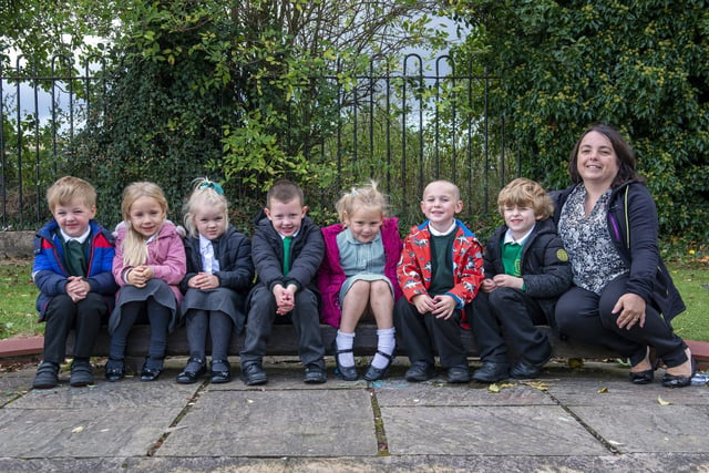 The youngest children at Haggonfields Primary School smile for the camera.