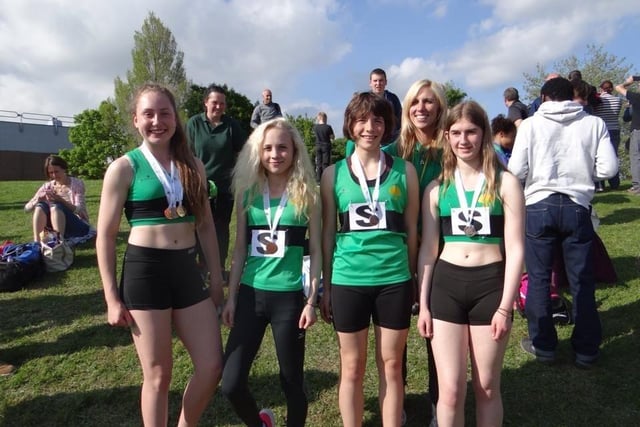 A former Worksop Harriers Under 15 girls relay team, and Amy Fendley, coach and long jump champion