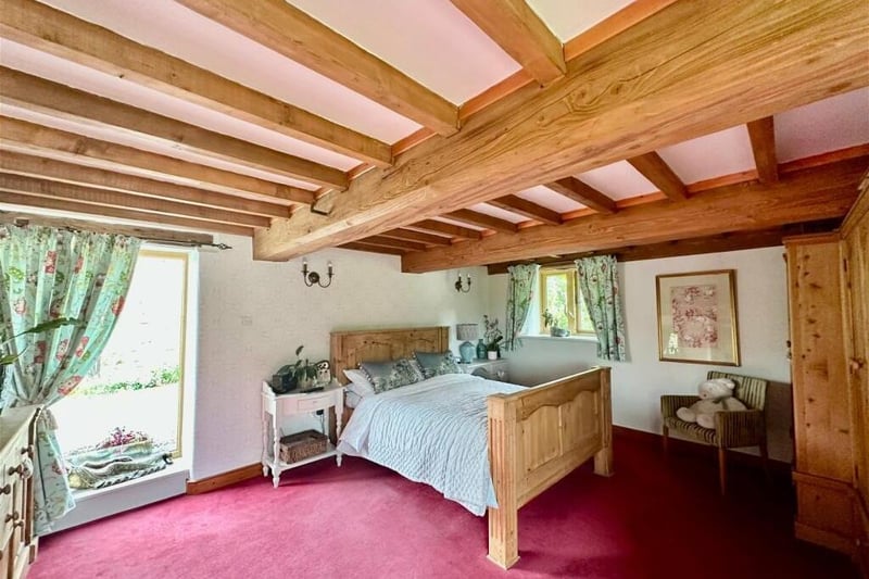 The £775,000 property's exposed ceiling beams are possibly at their magnificent best within the principal bedroom.