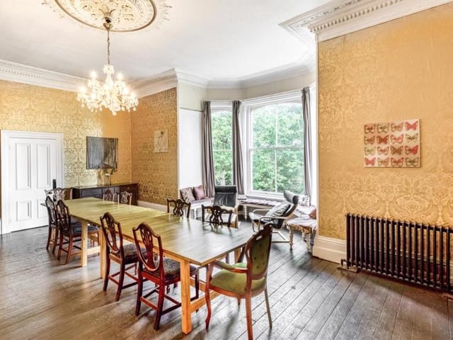 Imagine sitting down to dinner here. You would certainly feel like the lord or lady of the manor! The impressive dining room boasts a large bay window with a window seat, offering views of the countryside. It also has cast-iron radiators, oak flooring and a feature open fireplace.