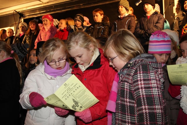 Retford Christmas Lights Switch On 2009 with Frankfurter style winter market of local food and drink and charity stalls pupils from Ordsall Primary School sang Christmas carols