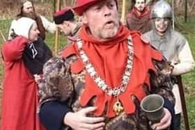 The Sheriff of Nottingham with the band of outlaws by the Major Oak in Sherwood Forest