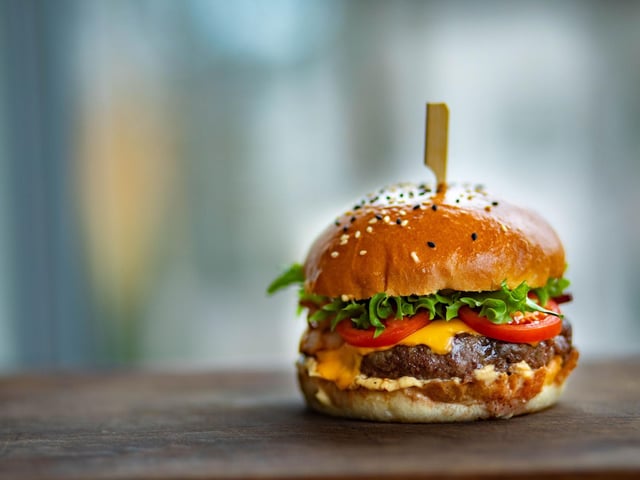 Try unusual meats like venison and pheasant in hand-made burgers from Fife's own Screaming Peacock. Find them on the ice rink on George's Street for a mid-skate bite to eat. Photo: Valeria Boltneva / Pexels / Canva Pro.