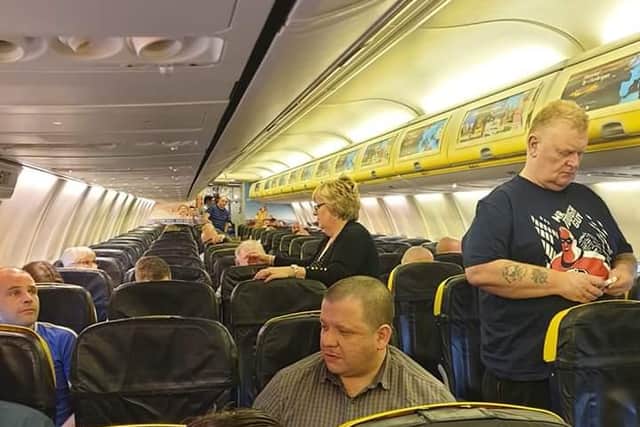 A picture shows a half-empty plane after passengers were given an ultimatum.