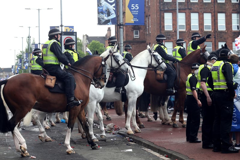 A heavy police presence surrounded Ibrox with officers also stationed in the city centre. Fans have been told to stay away from George Square. Picture: Robert Perry/PA