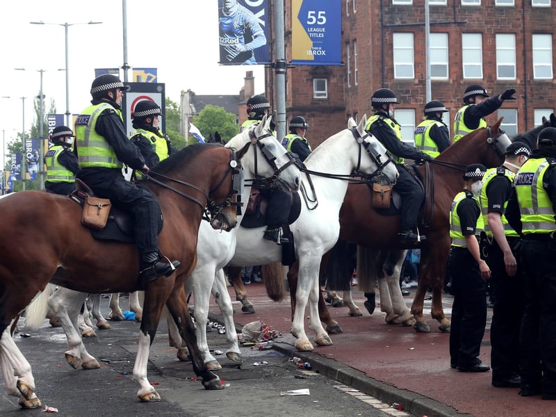 A heavy police presence surrounded Ibrox with officers also stationed in the city centre. Fans have been told to stay away from George Square. Picture: Robert Perry/PA