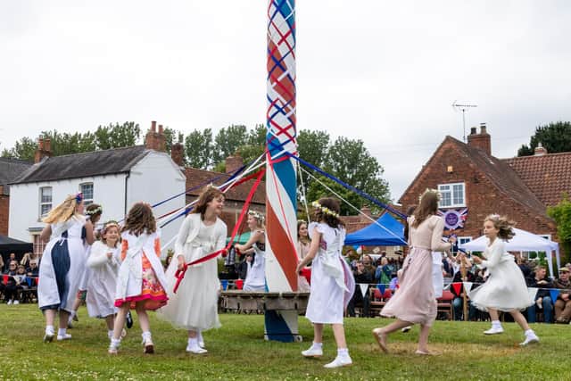 Youngsters dancing round the maypole during last year's Wellow event, which returned after a two-year absence because of Covid.