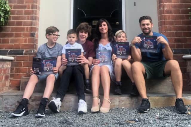 Pictured are Ric (right) with Victoria (centre) with her three sons (from left) George,
brother Harry holding Hugo, and Charlie.