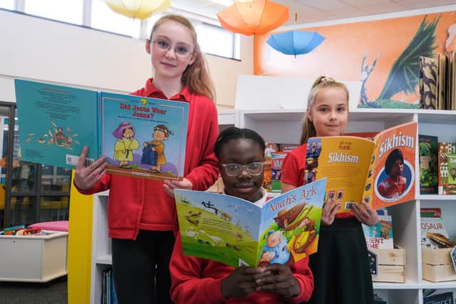 Children's Laureate Cressida Cowell MBE reading with pupils at Dinnigton Community Primary School's new library.