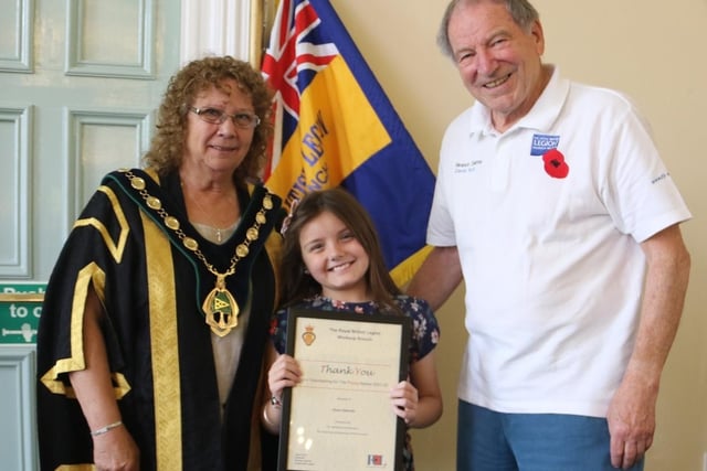 Elysia Edwards pictured with council chairman Madelaine Richardson and David Scott, chair of Worksop RBL branch.