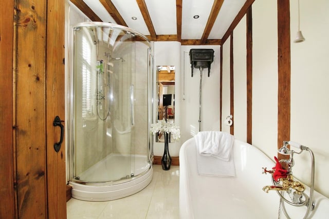 Marvel at the excellence of the en suite bathroom to the master bedroom. It comprises a roll-top, claw-foot bath with Victorian-style mixer tap attachment, high-flush WC, vanity wash hand basin and corner, tiled shower cubicle with shower.