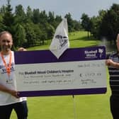 Left, Bluebell Wood’s Jason Gossop gratefully receiving the cheque from Bondhay’s Paul Leather, right.
