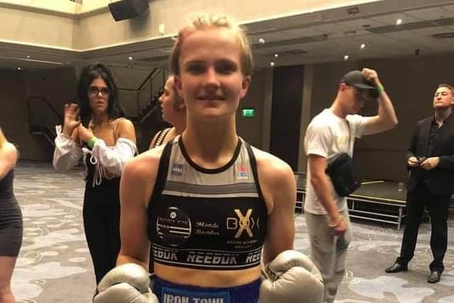 Hollie Towl became the youngest ever female world champion after winning the WIBA world featherweight title.