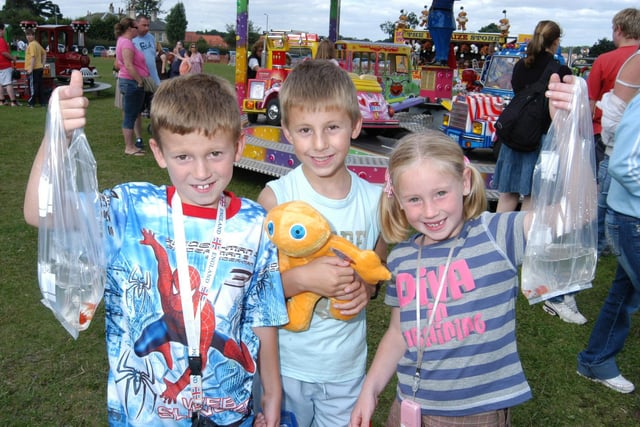 Kilton Showground, Worksop. Worksop Festival. Pictured, at the time (then): George Dickinson (8), Jacob Nuttall (7) and Meggan Dickinson with their goldfish and other prizes won on the fairground stalls.