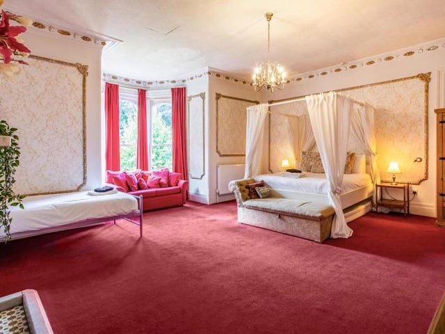 Here is the superb master bedroom, which the current owners say is one of their favourite rooms in the house. Full of natural light, it boasts a feature fireplace and large bay window, plus en suite facilities.