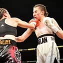 Nicola Hopewell, left, lands a punch on Emma Dolan. Picture by Astraea Media.