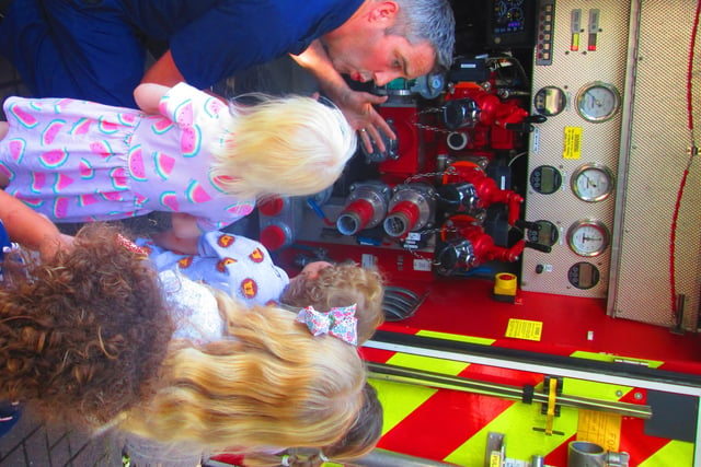 The fire crew showed the children the fire engine's vital hoses.