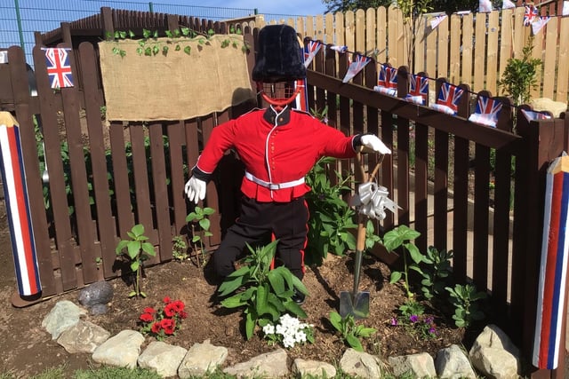 Despite having a broken shoulder, one granny created a Royal Guard-inspired scarecrow for the allotment. She also donated a sparkling new spade for him to use.