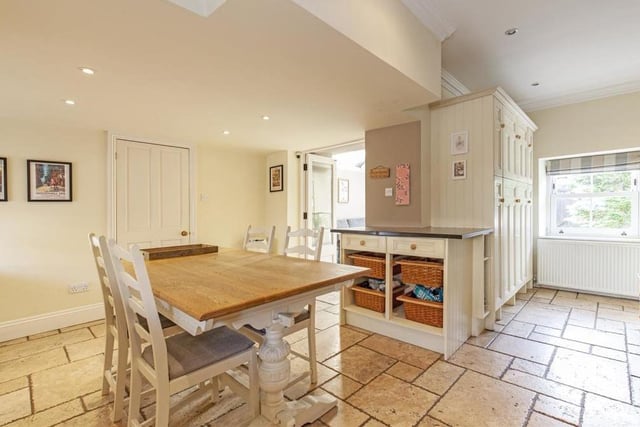 A tiled floor and sash windows at the front and back add to the rustic appearance of the kitchen/diner. An electric Rangemaster cooker with five-ring hob, plus double ovens and a grill, are all ideal for conjuring up a feast for any occasion.