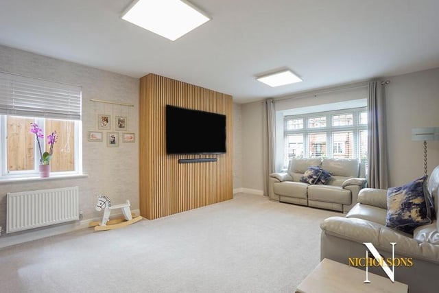 Let';s begin our tour of the £510,000 Shireoaks property in the living room or sitting room, A contemporary and comfortable space, it faces the front of the house.