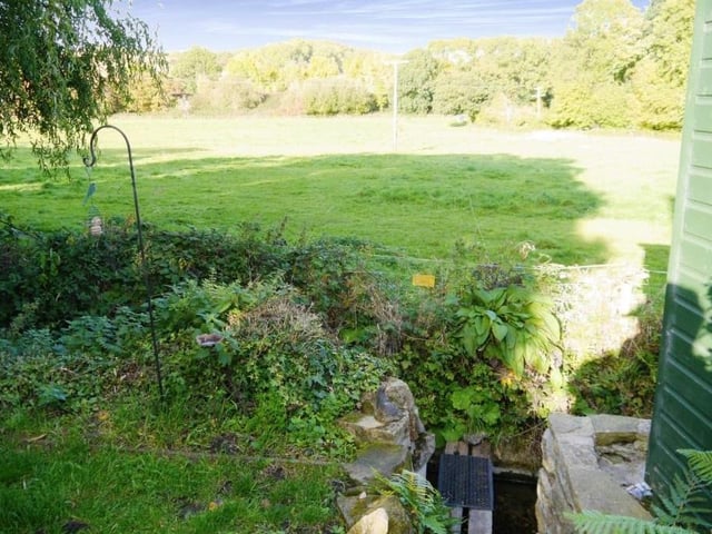 The rear exterior of the Turnerwood cottage offers a truly rural scene.