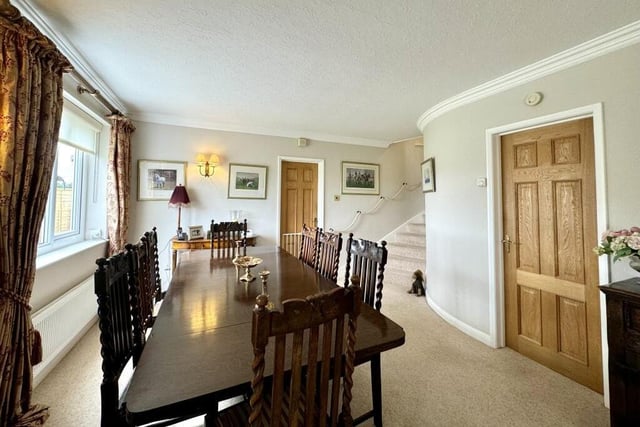 The living rooms flows into this delightful dining room, which also faces the front of the house. A perfect spot for family meals or for entertaining friends.