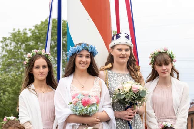 The crowning of last year's May queen, Ellie Wilson (second from right). She is pictured with the retiring queen, Lucy Hollingworth (second from left), and train bearers Evie Hollingworth and Charlotte Taylor.