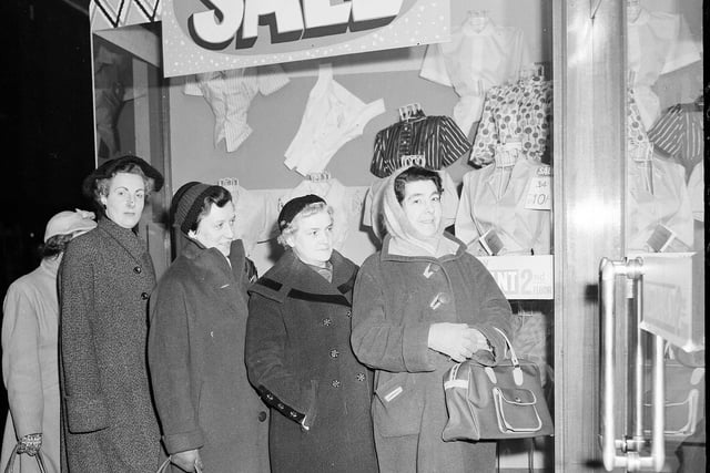 Wrapped up against the early morning cold, a group of intrepid bargain hunters are first in the queue at Blyth's department store in Earl Grey Street for the start of the January sale in 1959.