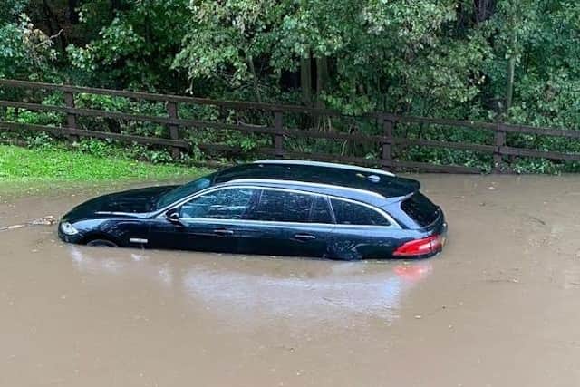 A car submerged by flood water after Storm Babet.
