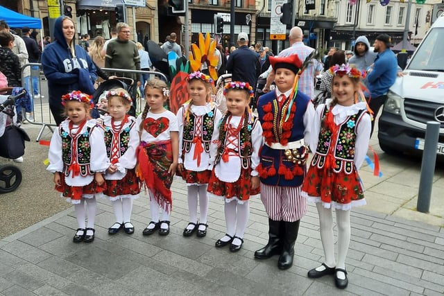 Children at Worksop's Polish Saturday School dressed in traditional clothing before performing a dance for onlookers.