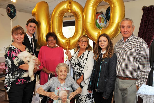 One hundred year old Eileen Hicking is surrounded by her family during her birthday celebration in 2016.  From left, are grandaughter Louise Sutton, great grandson Jude Sutton, daughters Elaine Henderson and Mal Richardson, great grandaughter Madeleine Sutton and Colin Barratt.