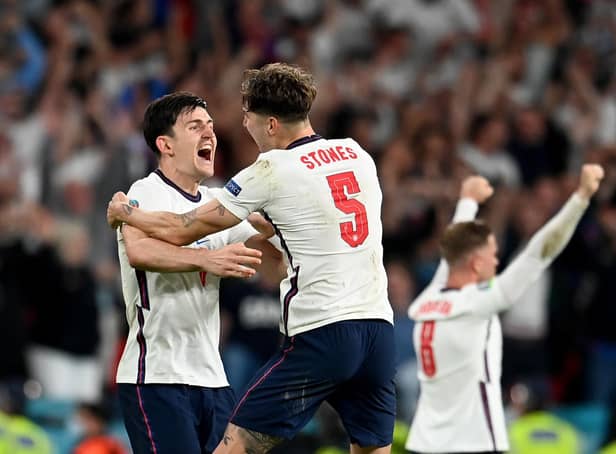 Harry Maguire and John Stones celebrate England's victory over Denmark at Euro 2020. (Photo by Andy Rain - Pool/Getty Images)